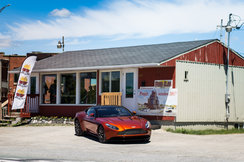 Illustration for article titled Chasing Canada's Greasiest People's Food In A $200,000 Aston Martin
